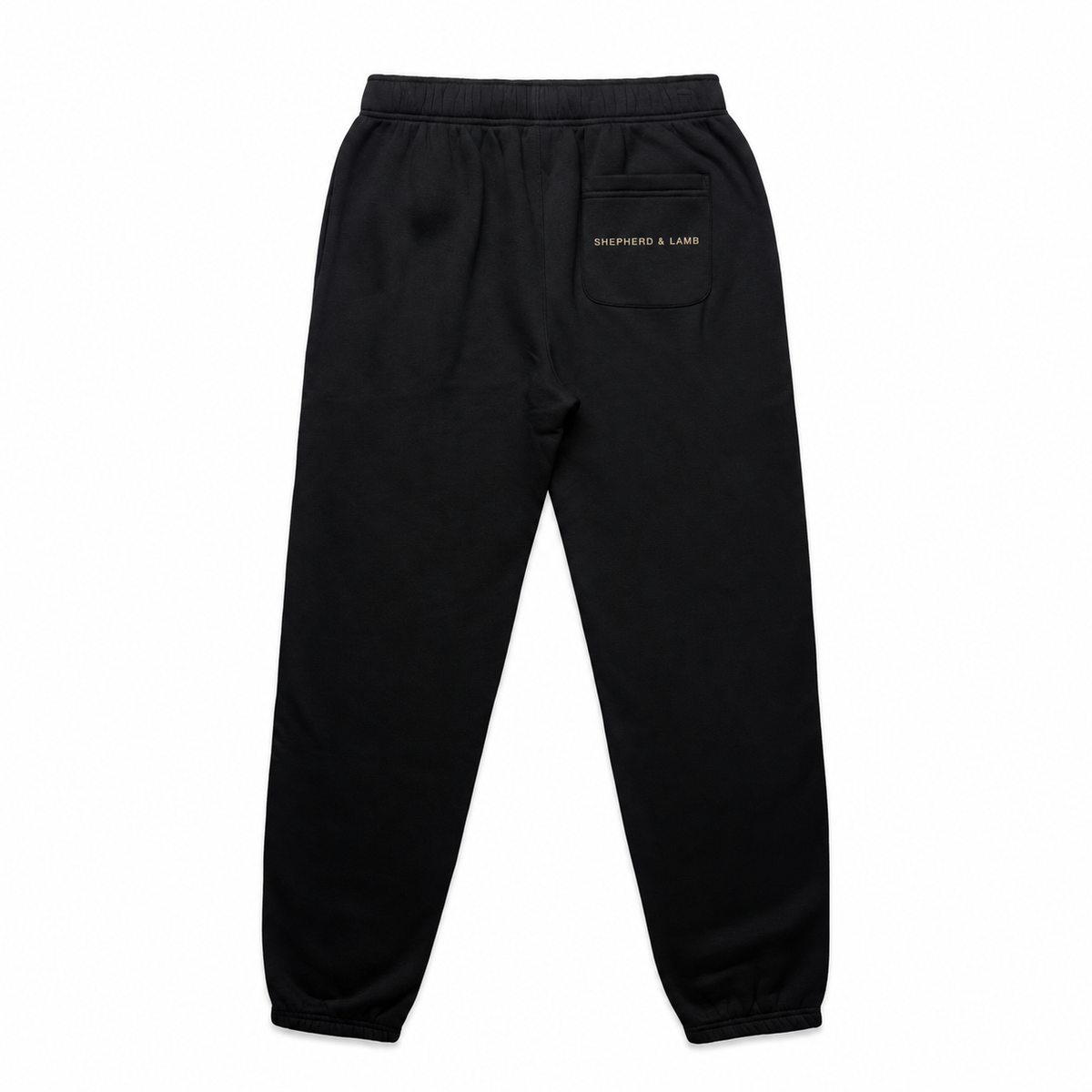 Back view of the Shepherd & Lamb Signature Relax Track Pants in Black, showing the Shepherd & Lamb wordmark on the rear pocket.