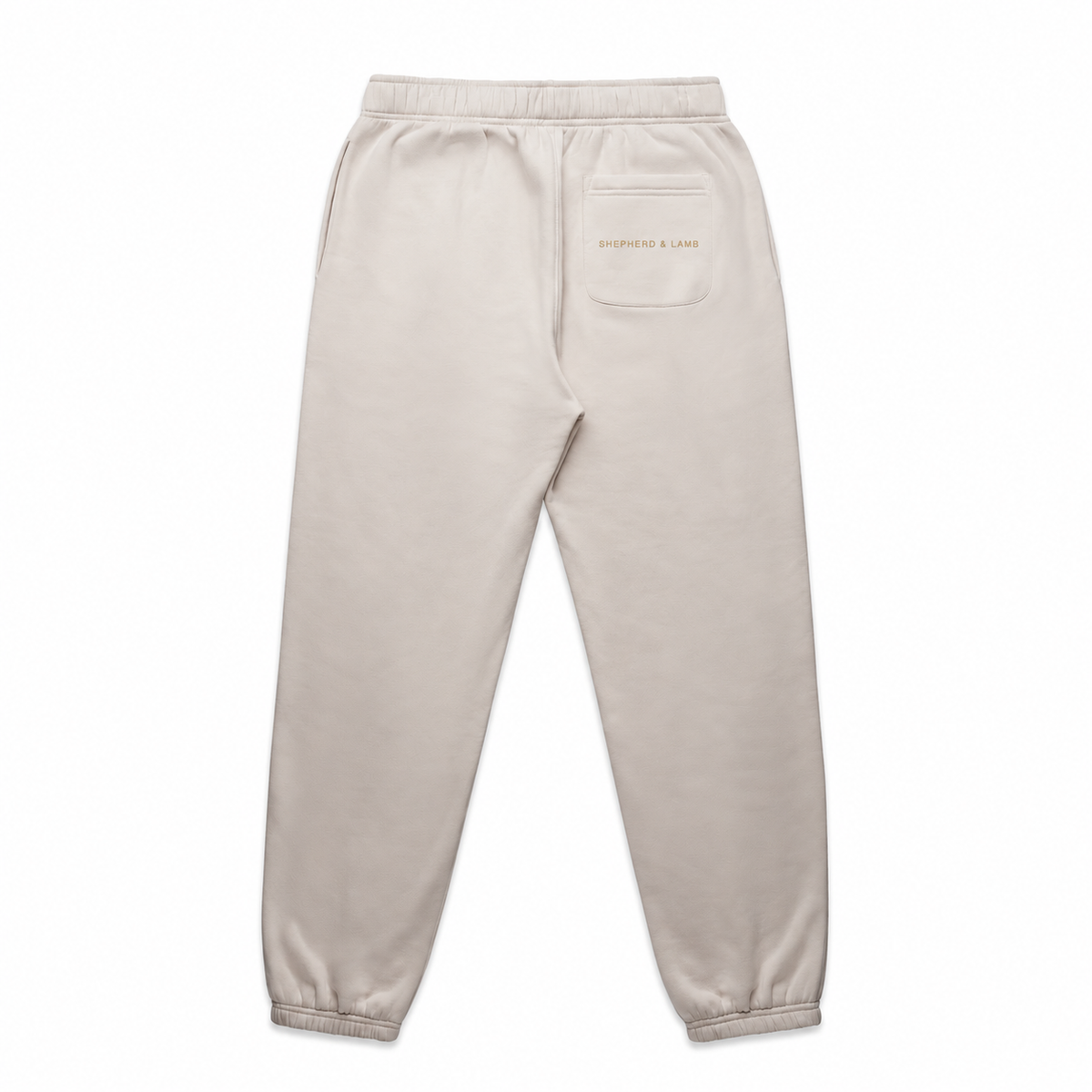 Back view of the Shepherd & Lamb Signature Relax Track Pants in Bone, showing the Shepherd & Lamb wordmark on the rear pocket.