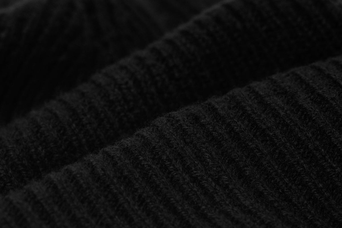 Original manufacturer close-up of the Black cashmere-merino rib knit used for the Signature Cashmere Merino Beanie.