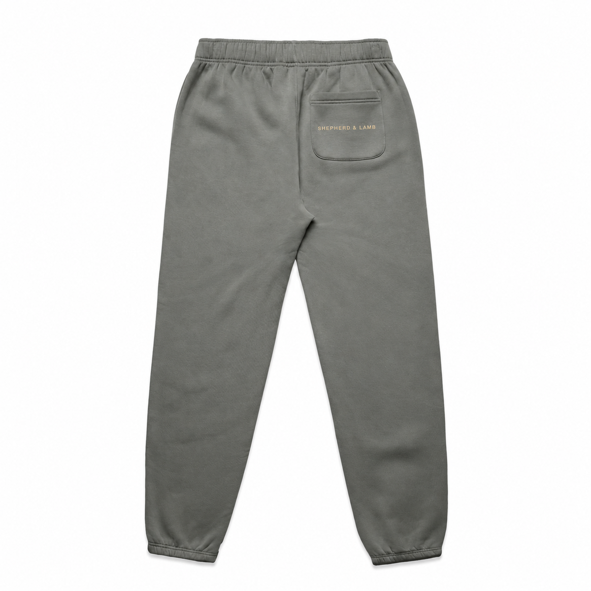 Back view of the Shepherd & Lamb Signature Relax Track Pants in Shadow, showing the Shepherd & Lamb wordmark on the rear pocket.
