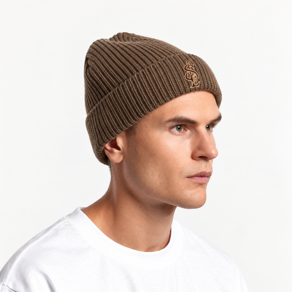 Model wearing the Shepherd & Lamb Signature Gauge Beanie in Walnut, showing the front design and fit.