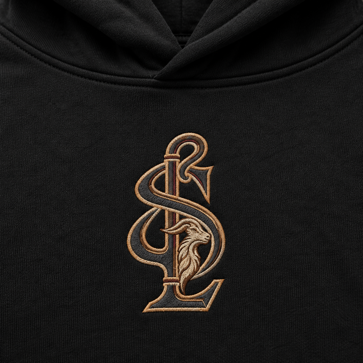 Close-up artwork preview of the Shepherd & Lamb monogram on the Black Signature Relax Hoodie.