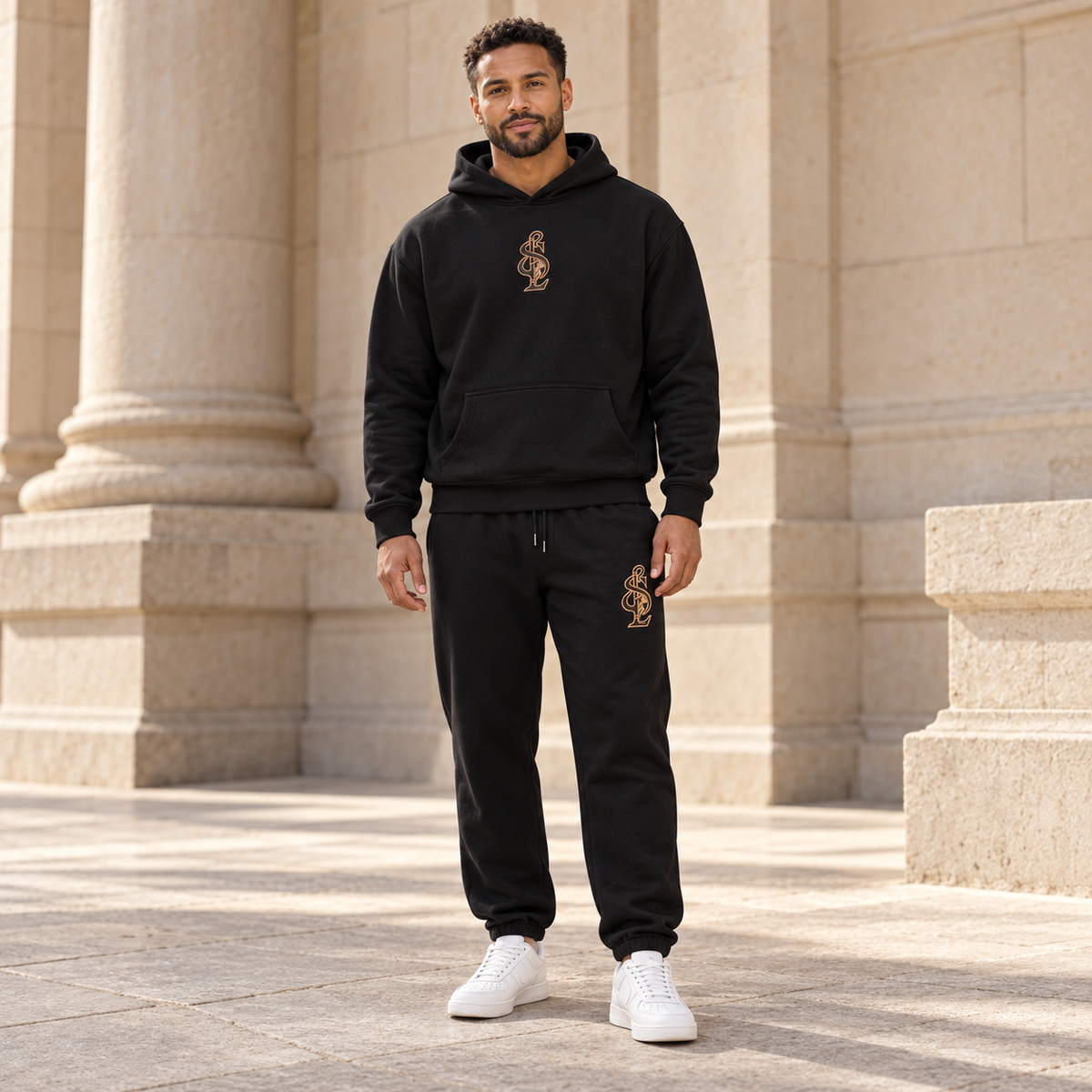 Black Signature Relax Hoodie styled with coordinating Relax Track Pants. Pieces sold separately.